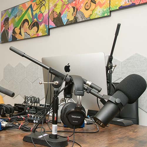 laptop and recording equipment on a desk